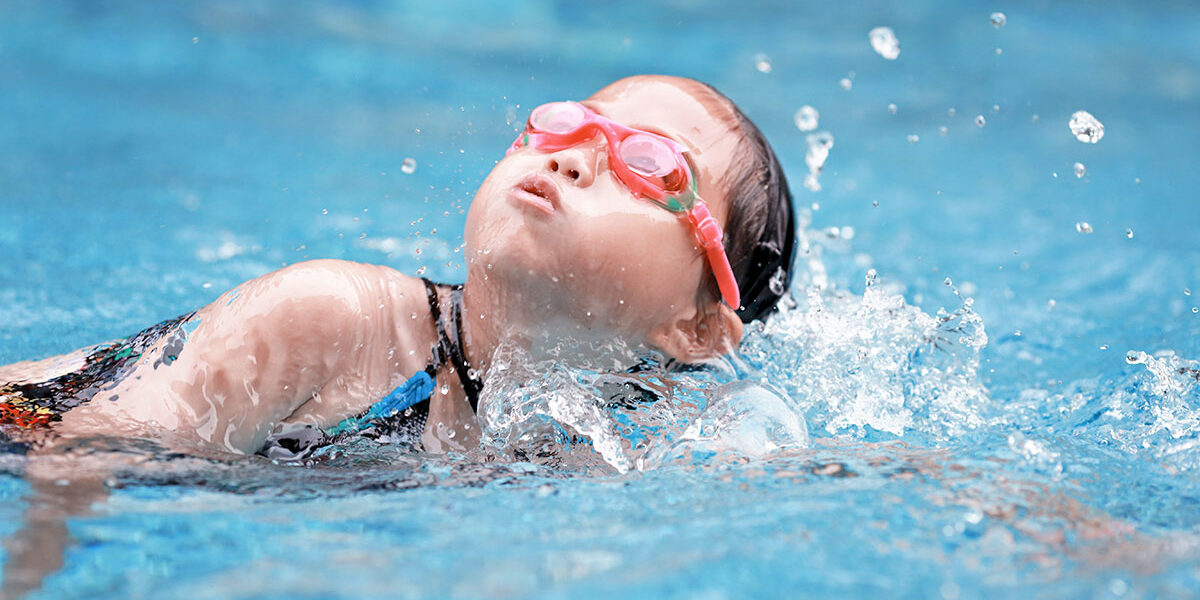 child swimming well
