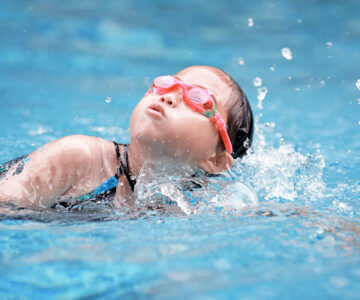 child swimming well