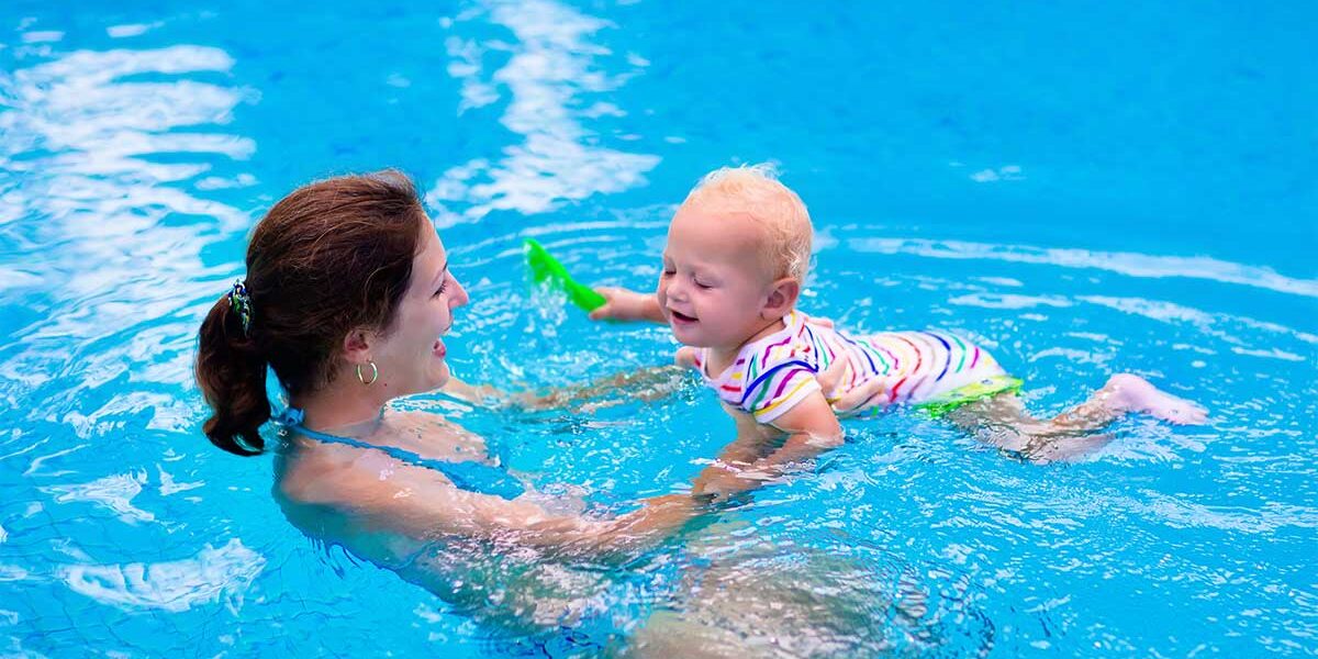 mother and baby in pool