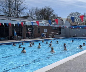 aqua/water aerobics class on a sunny dayin outdoor pool